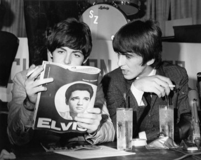 Paul McCartney reads Elvis Presley magazine